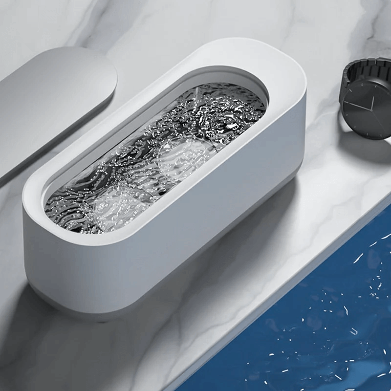 AuraClean – Netejador ultrasònic de ulleres, compacte i segur per a lents