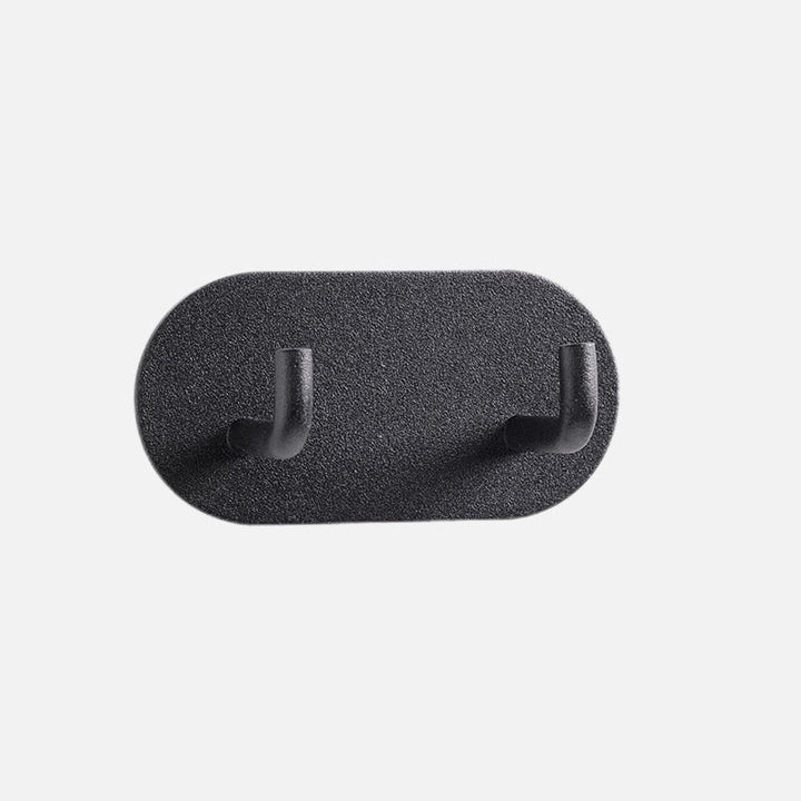 Gancho de pared Zintra – Hierro forjado pastel con tira adhesiva 3M, sin taladrar