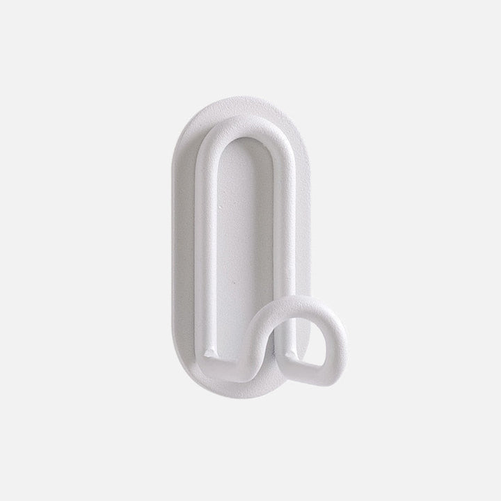 Gancho de pared Zintra – Hierro forjado pastel con tira adhesiva 3M, sin taladrar