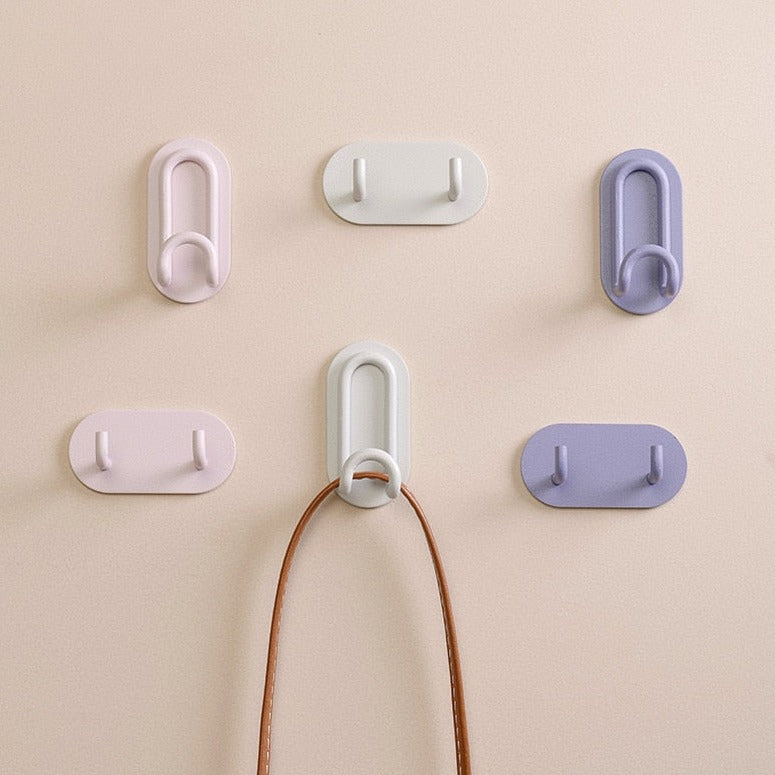 Gancho de pared Zintra – Hierro forjado pastel con tira adhesiva 3M, sin taladrar