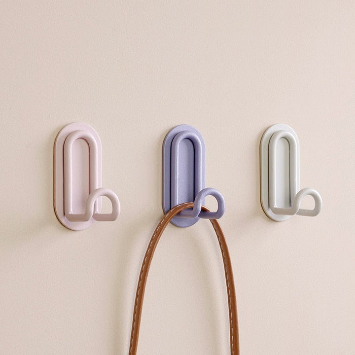 Gancho de pared Zintra – Hierro forjado pastel con tira adhesiva 3M, sin taladrar