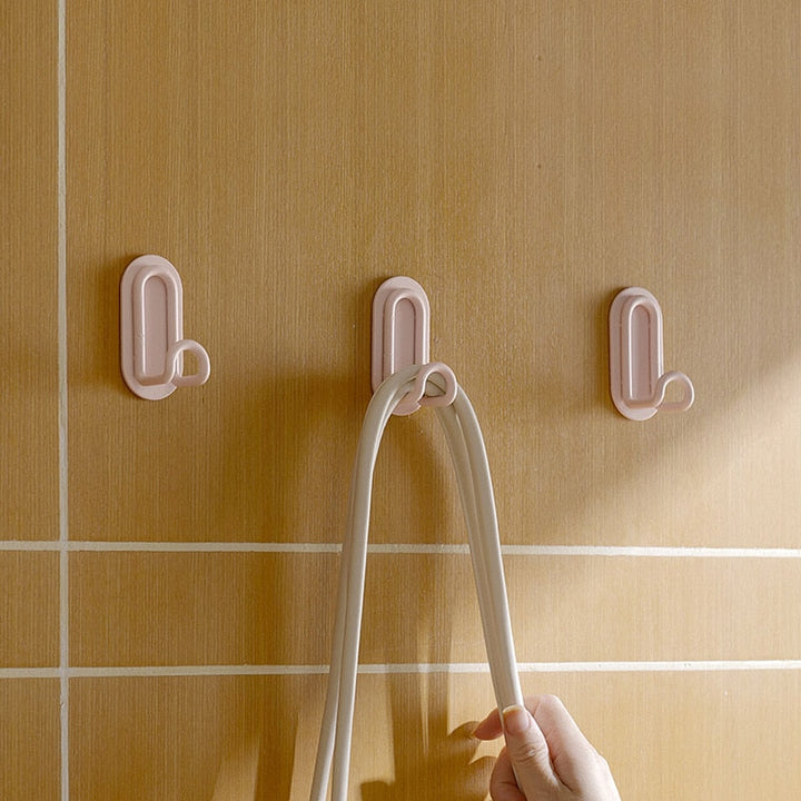 Gancho de pared Zintra – Hierro forjado pastel con tira adhesiva 3M, sin taladrar