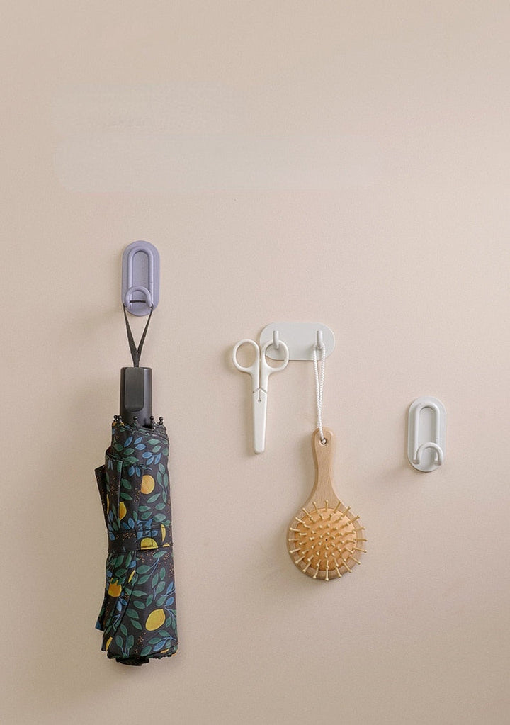 Gancho de pared Zintra – Hierro forjado pastel con tira adhesiva 3M, sin taladrar