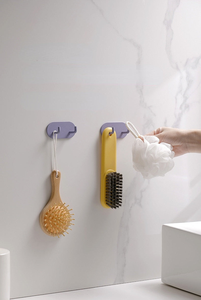 Gancho de pared Zintra – Hierro forjado pastel con tira adhesiva 3M, sin taladrar