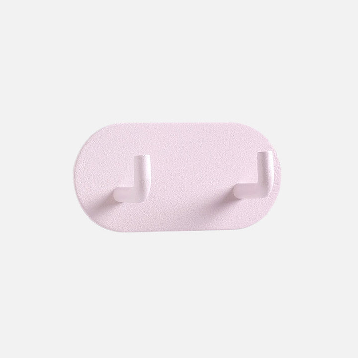 Gancho de pared Zintra – Hierro forjado pastel con tira adhesiva 3M, sin taladrar