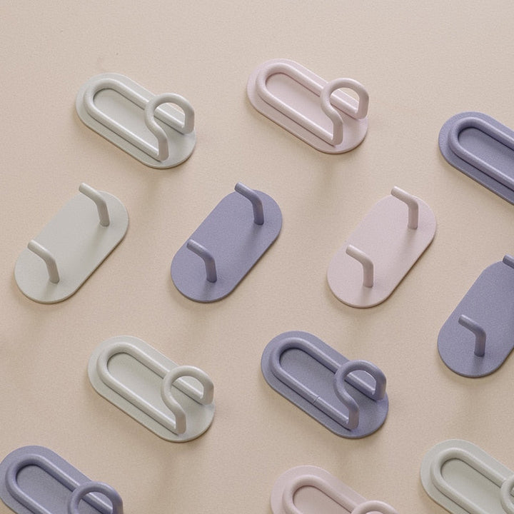 Gancho de pared Zintra – Hierro forjado pastel con tira adhesiva 3M, sin taladrar