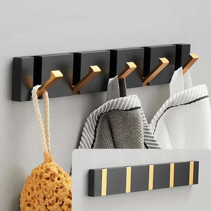 Opvouwbare wandhaak – Ruimtebesparend, stevig &amp; modern zwart met gouden accenten
