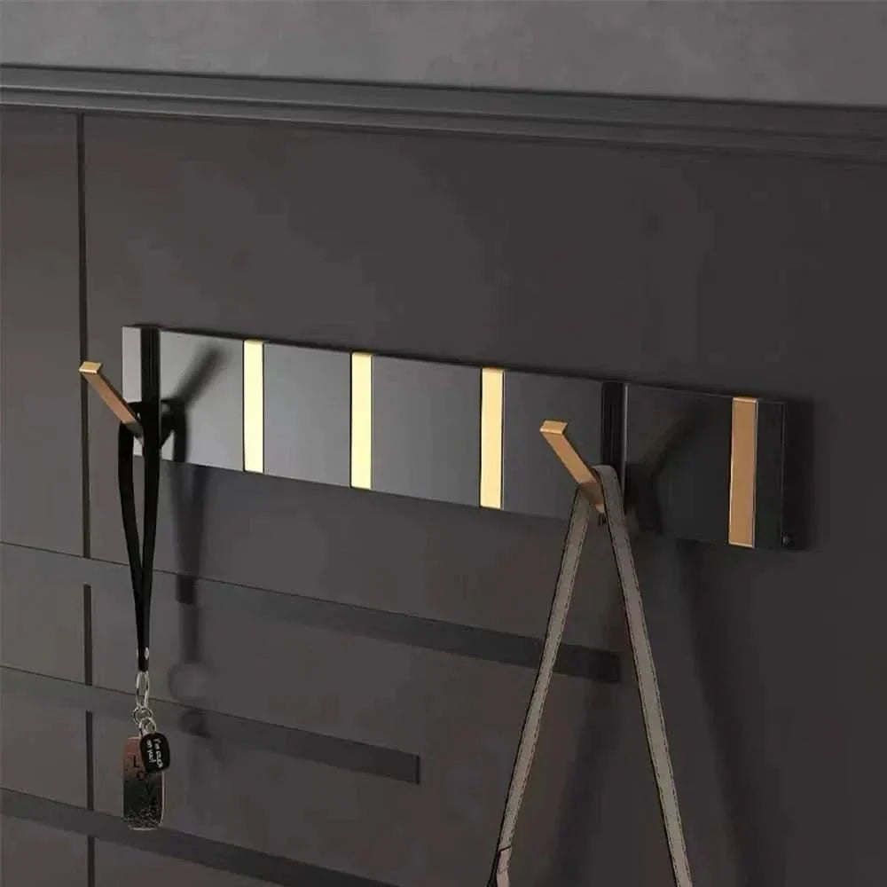 Gancio da parete pieghevole – Salvaspazio, robusto e moderno nero con accenti dorati